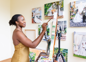 Live painter creating artwork during event